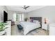 Bright and airy main bedroom features a king-sized bed, plantation shutters, and modern decor at 20121 N 76Th St # 1019, Scottsdale, AZ 85255