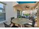 Covered patio with dining table and comfortable seating, perfect for outdoor relaxation at 20121 N 76Th St # 1019, Scottsdale, AZ 85255