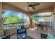 Covered patio with comfortable seating and views of the lush landscaping at 20121 N 76Th St # 1019, Scottsdale, AZ 85255