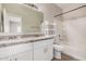 Clean bathroom with double sinks, granite counters, and a shower-tub combo at 2024 E Dust Devil Dr, San Tan Valley, AZ 85143