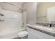 Bathroom featuring a tub and shower combination, a toilet, and a granite countertop at 2024 E Dust Devil Dr, San Tan Valley, AZ 85143