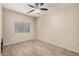 Neutral bedroom featuring wood floors and a window at 2024 E Dust Devil Dr, San Tan Valley, AZ 85143