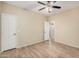 Bedroom featuring wood flooring and a closet at 2024 E Dust Devil Dr, San Tan Valley, AZ 85143