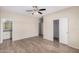 Primary bedroom with tiled floors, fan, ensuite bathroom and closet at 2024 E Dust Devil Dr, San Tan Valley, AZ 85143