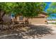 Charming single-story home featuring a two car garage and desert landscaping in the front yard at 2024 E Dust Devil Dr, San Tan Valley, AZ 85143