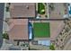 This overhead view shows a backyard with desert landscaping, artificial turf, and shade structures at 20638 N 11Th St, Phoenix, AZ 85024