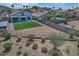 Expansive backyard featuring low-maintenance desert landscaping and a lush green lawn at 20638 N 11Th St, Phoenix, AZ 85024