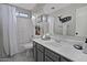 Clean bathroom showcases a shower-tub combo and modern gray vanity at 20638 N 11Th St, Phoenix, AZ 85024