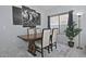 Elegant dining room featuring a wood table, upholstered chairs, and modern artwork at 20638 N 11Th St, Phoenix, AZ 85024