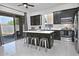 Modern kitchen featuring dark cabinets, stainless steel appliances, a center island, and sliding glass doors at 20638 N 11Th St, Phoenix, AZ 85024