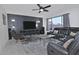 Comfortable living room with large TV, stylish decor, and inviting seating area at 20638 N 11Th St, Phoenix, AZ 85024