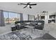 Spacious living room has a ceiling fan and large windows that provide plenty of natural light at 20638 N 11Th St, Phoenix, AZ 85024