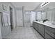 The main bathroom includes dual sinks, a full mirror, and a shower-tub combination at 20638 N 11Th St, Phoenix, AZ 85024