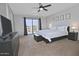 The main bedroom features a ceiling fan, balcony access, and views of the neighborhood at 20638 N 11Th St, Phoenix, AZ 85024