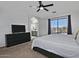 The primary bedroom has balcony access, a ceiling fan, and connects to the primary bathroom at 20638 N 11Th St, Phoenix, AZ 85024