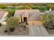 Beautiful aerial view of a home with tile roofing and a three car garage in a lush golf course community at 22231 N 55Th St, Phoenix, AZ 85054