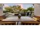 Charming outdoor dining area featuring an outdoor kitchen, fire pit, and a serene pool for relaxation and entertainment at 22231 N 55Th St, Phoenix, AZ 85054