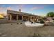 Relaxing backyard features a fire pit, pool, seating, and desert landscaping at 22231 N 55Th St, Phoenix, AZ 85054