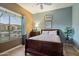 Cozy bedroom filled with natural light from a large window, creating a welcoming and serene atmosphere at 22231 N 55Th St, Phoenix, AZ 85054
