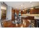Well-appointed kitchen featuring rich wood cabinetry, stainless steel appliances and a cozy breakfast nook at 22231 N 55Th St, Phoenix, AZ 85054
