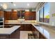 Functional kitchen with custom cabinetry, modern appliances, ample counter space and a bright, sunny window at 22231 N 55Th St, Phoenix, AZ 85054