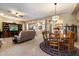 Open-concept living space with a fireplace, media center, tile floors and elegant decor creating a welcoming ambiance at 22231 N 55Th St, Phoenix, AZ 85054