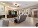 Spacious living room featuring a fireplace, built-in entertainment center and tile flooring for easy maintenance at 22231 N 55Th St, Phoenix, AZ 85054