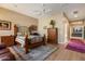 Comfortable bedroom with wood floors, an area rug, and neutral walls at 22231 N 55Th St, Phoenix, AZ 85054