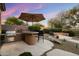 Custom outdoor bar with grill and counter space, perfect for entertaining guests at 22231 N 55Th St, Phoenix, AZ 85054