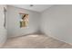 A bedroom featuring tile floors and a window with a view at 22815 N Arrellaga Dr, Sun City West, AZ 85375