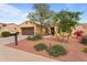 Inviting single-Gathering home featuring a well-maintained yard and a convenient two-car garage at 22815 N Arrellaga Dr, Sun City West, AZ 85375