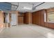 Spacious garage featuring built-in storage cabinets and epoxy flooring for durability at 22815 N Arrellaga Dr, Sun City West, AZ 85375