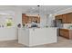 Well-appointed kitchen featuring stainless steel appliances, sleek countertops, and ample cabinet space at 22815 N Arrellaga Dr, Sun City West, AZ 85375