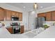 Modern kitchen with stainless steel appliances and sleek countertops at 22815 N Arrellaga Dr, Sun City West, AZ 85375