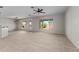 Spacious open-concept living room with tile flooring, perfect for entertaining at 22815 N Arrellaga Dr, Sun City West, AZ 85375