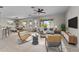 Bright and airy living room with tile floors and modern furnishings at 22815 N Arrellaga Dr, Sun City West, AZ 85375