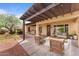 Inviting covered patio with stylish furniture, perfect for outdoor lounging and entertaining at 22815 N Arrellaga Dr, Sun City West, AZ 85375