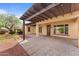 Covered patio area showcasing seamless indoor-outdoor living and access to backyard at 22815 N Arrellaga Dr, Sun City West, AZ 85375