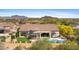 A beautiful backyard with a pool, putting green, outdoor fire pit, and covered patios at 2304 N Steele Cir, Mesa, AZ 85207