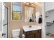 Bathroom with a sink, toilet, and walk-in shower and a window view at 2304 N Steele Cir, Mesa, AZ 85207
