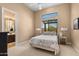 Bedroom with ensuite bathroom and accent window with natural light at 2304 N Steele Cir, Mesa, AZ 85207