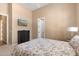 Bedroom featuring a patterned comforter, dark dresser, and bright ensuite at 2304 N Steele Cir, Mesa, AZ 85207