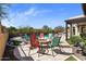 Cozy fire pit area surrounded by chairs, creating a welcoming space for outdoor gatherings and relaxation at 2304 N Steele Cir, Mesa, AZ 85207