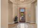 Inviting foyer with a decorative tile floor and a decorative front door at 2304 N Steele Cir, Mesa, AZ 85207