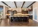 Gourmet kitchen featuring custom cabinetry, granite countertops, and a large central island at 2304 N Steele Cir, Mesa, AZ 85207