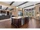 Open kitchen layout with large island, stainless steel appliances, and seamless access to living spaces at 2304 N Steele Cir, Mesa, AZ 85207