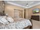Bright main bedroom featuring a sliding barn door and a decorative accent wall at 2304 N Steele Cir, Mesa, AZ 85207