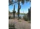 Community pool is surrounded by cacti and desert vegetation, as well as brick pavers and outdoor shade structures at 2304 N Steele Cir, Mesa, AZ 85207