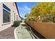 Side yard putting green along house, providing a fun and convenient recreational area at 2304 N Steele Cir, Mesa, AZ 85207