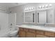 The bathroom has double sinks and bright vanity lighting at 23829 N 36Th Dr, Glendale, AZ 85310